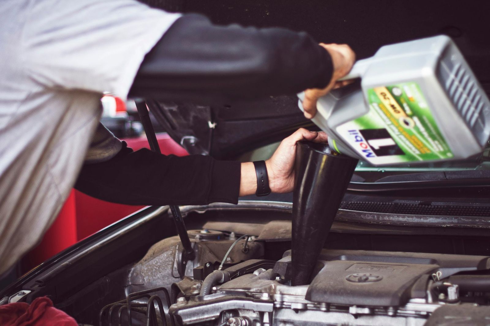 Technician working in the engine bay