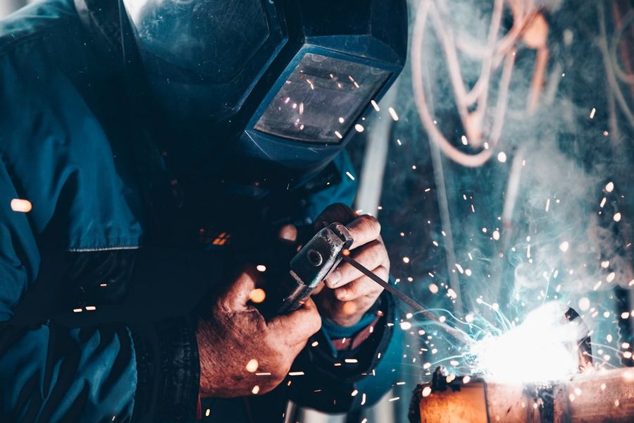 Welder at work with a shower of sparks